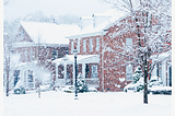 Frost painted windows on houses in a winter storm