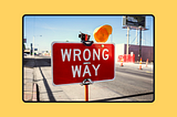 Red sign saying “Wrong way”