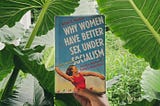 The book ‘Why Women Have Better Sex Under Socialism’ in the backdrop of some monstrous Alocasia.