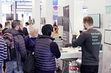 Wisebatt employee presenting the company on a booth at embedded world 2019