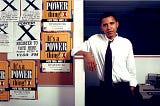 Former U.S. President Barack Obama posing with voter registration flyers in the 1980s as a community organizer in Chicago, IL.