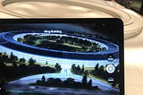 A tablet showing an Augmented Reality version of the Apple’s Headquarters.