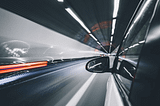 image showing a car in dark tunnel