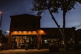 Photo of a small boutique hotel at night.