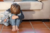 a photo of an upset child showing the importance of helping children cope with loneliness