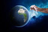 The image depicts a human hand holding a paintbrush, which is touching a realistically rendered Earth against the backdrop of space. The Earth is centered on the South American continent, which is illuminated by the brush as if being painted or highlighted by the artist. The surrounding space is deep blue and dotted with stars, giving the impression that the Earth is being artistically enhanced or created within the vast cosmos.