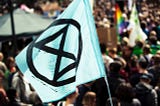Activism with an Extinction Rebellion protest flag