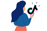 Woman looking at a phone  emanating a large TikTok logo