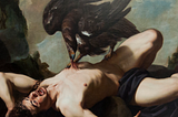 A light-skinned man lies naked, prone on a rock. His arms are bound with chains, and his mouth is open in a yell. A large, black bird stands on top of him, biting at his abdomen with its beak.