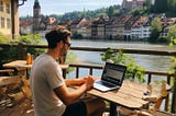 Digital nomad working by the river in Germany