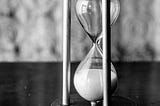 An hourglass with all the sand at the bottom — time’s up!