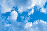 image of a blue sky with white clouds, by the Author