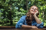 Woman looking up smiling.