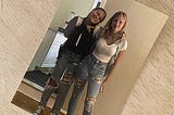 Photo of the author’s two daughters dressed in a style the call dumpster chic.