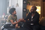 African-American father and son bonding and holding hands