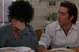 Cher covers her face while Nicholas Cage looks on in this still from Moonstruck.