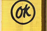 OK symbol on a yellow garage door.