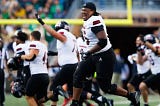 Northern Illinois offensive lineman Abiathar Curry jumps in the air in celebration after wining a NCAA college football game 16–14 against Notre Dame at Notre Dame Stadium on Saturday, Sept. 7, 2024, in South Bend. (Curt Rallo / The Associated Press)