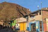 Brightly painted homes and shops in Urubamba, Peru