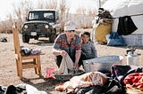 Mongolian woman with child washing clothes