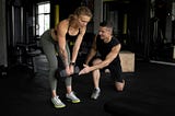 Personal trainer and client