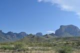 Out of an abyssal sea of sand the chisos mountains rise to dominate the horizon in southern taxes .