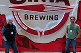 Uinta Brewing President, Jeremy Ragonese (left) and V.P. of Sales, Noah Brown (right) stand outside the Airport Pub.