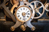 Old clock driving the mechanism for triggering the bells of a church in France