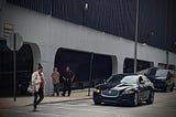 A prisoner being transported with police escort.