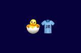 Dois emojis na imagem. Emoji 1: Pintinho nascendo de um ovo. Emoji 2: Camiseta T-shirt azul escrito “JR” na área frontal.