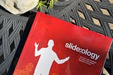 The book Slide:ology sitting on my patio table.