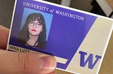 A picture of a University of Washington student ID that says “Nina Lutz” and a picture of the author. The author is a dark haired white woman with bangs, glasses, and red lipstick.