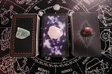 Three tarot piles with crystals arranged on a cloth. Each pile represents a unique soulmate reading — Pile One, Pile Two, and Pile Three — inviting the viewer to intuitively choose.