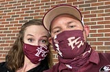 Me and my wife sitting against the bricks in Doak Campbell Stadium wearing our masks to protect those around us.