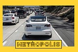 A Tesla driving in freeway traffic