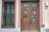 an old door in Barcelona. The old architecture is absolutely beautiful, and replicated in the Mexican city of Merida almost exactly.