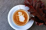 Latte art with a ghost in the foam