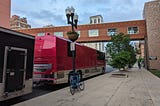This shows a pink tour bus.