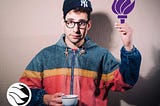 Jack Antonoff holding a graphic of the NYU Torch.