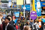 Busy oxford road during welcome week, crowds, magic buses, ask me signs