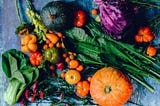 colorful photo of harvest of pumpkins, gourds, greens and cabbages