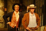Color photo of wax museum sculptures depicting Robert Redford & Paul Newman as Butch Cassidy & the Sundance Kid at Madame Tussaud’s.