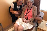 A girl with older lady in the nail salon.