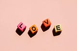 Four letters: l, o, v, e on dices
