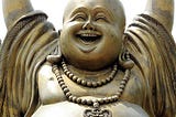 What is the Laughing Buddha laughing at?