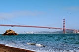 A photo of the Golden Gate Bridge taken from a beach north of San Francisco.