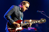 Joe Bonamassa on-stage with electric guitar