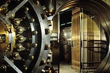 A bank vault door open.