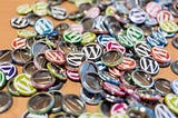 An image of wearable wordpress buttons/pins.