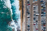 Parking lot across from the sea.